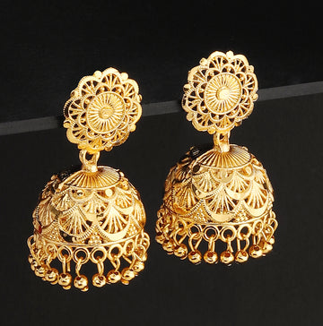 A pair of intricately designed gold-plated jhumka earrings from the Mekkna brand, featuring detailed craftsmanship and a luxurious finish.