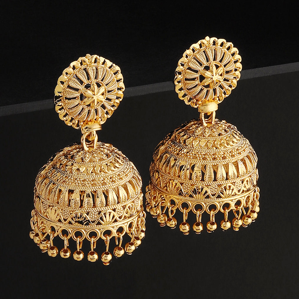 A pair of intricately designed gold-plated jhumka earrings from the Mekkna brand, featuring detailed craftsmanship and a luxurious finish.