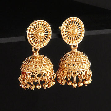 A pair of intricately designed gold-plated jhumka earrings from the Mekkna brand, featuring detailed craftsmanship and a luxurious finish.