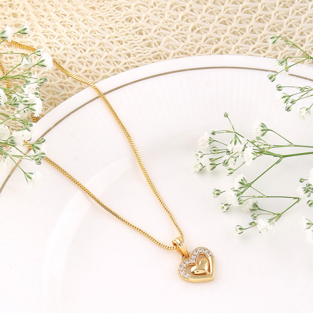 A luxurious Mekkna gold plated pendant with intricate design, showcasing elegance and timeless beauty.