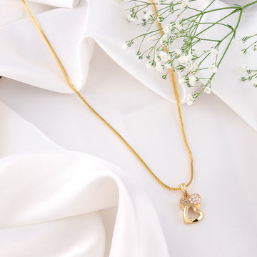 A luxurious Mekkna gold plated pendant with intricate design, showcasing elegance and timeless beauty.