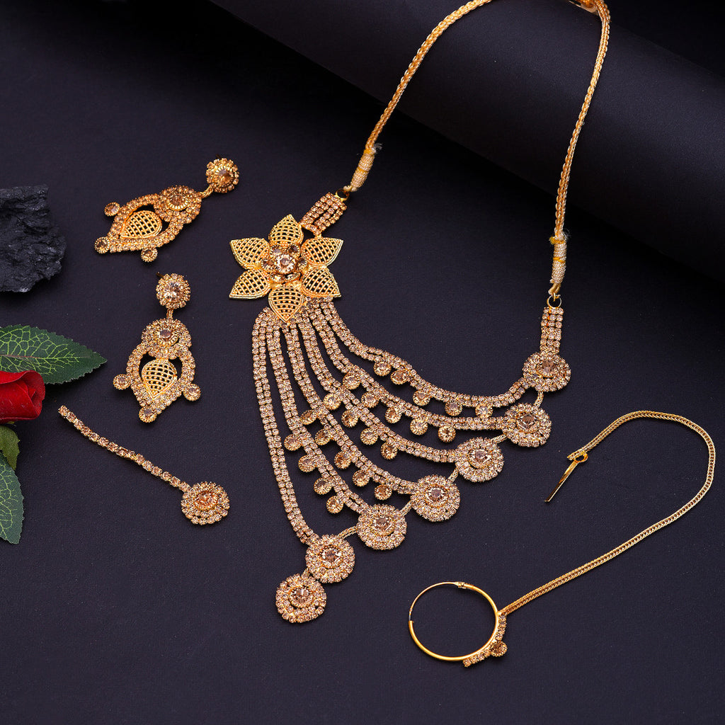 Best Gold Plated Traditional Handcrafted Designed by Mekkna of Necklace, Nose-Pin, Maang-Tika with Earrings for Women. Now We can Book This Jewellery set online from Mekkna.